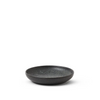 Black ceramic sauce dish on a white background