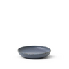 Blue ceramic sauce dish on a white background