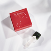 Red Scorpio zodiac collection box with a green crystal on a white background