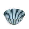 Blue and white striped ceramic bowl on a white background