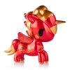 Red and gold unicorn figurine on a white background