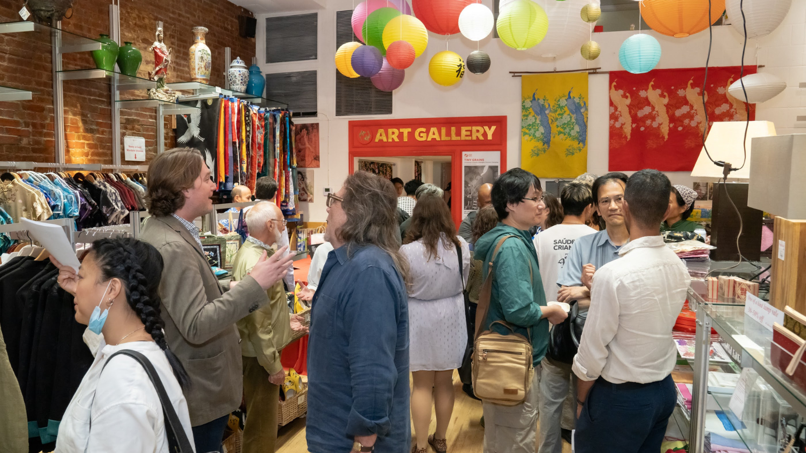 Guests at a Pearl River Mart art gallery opening