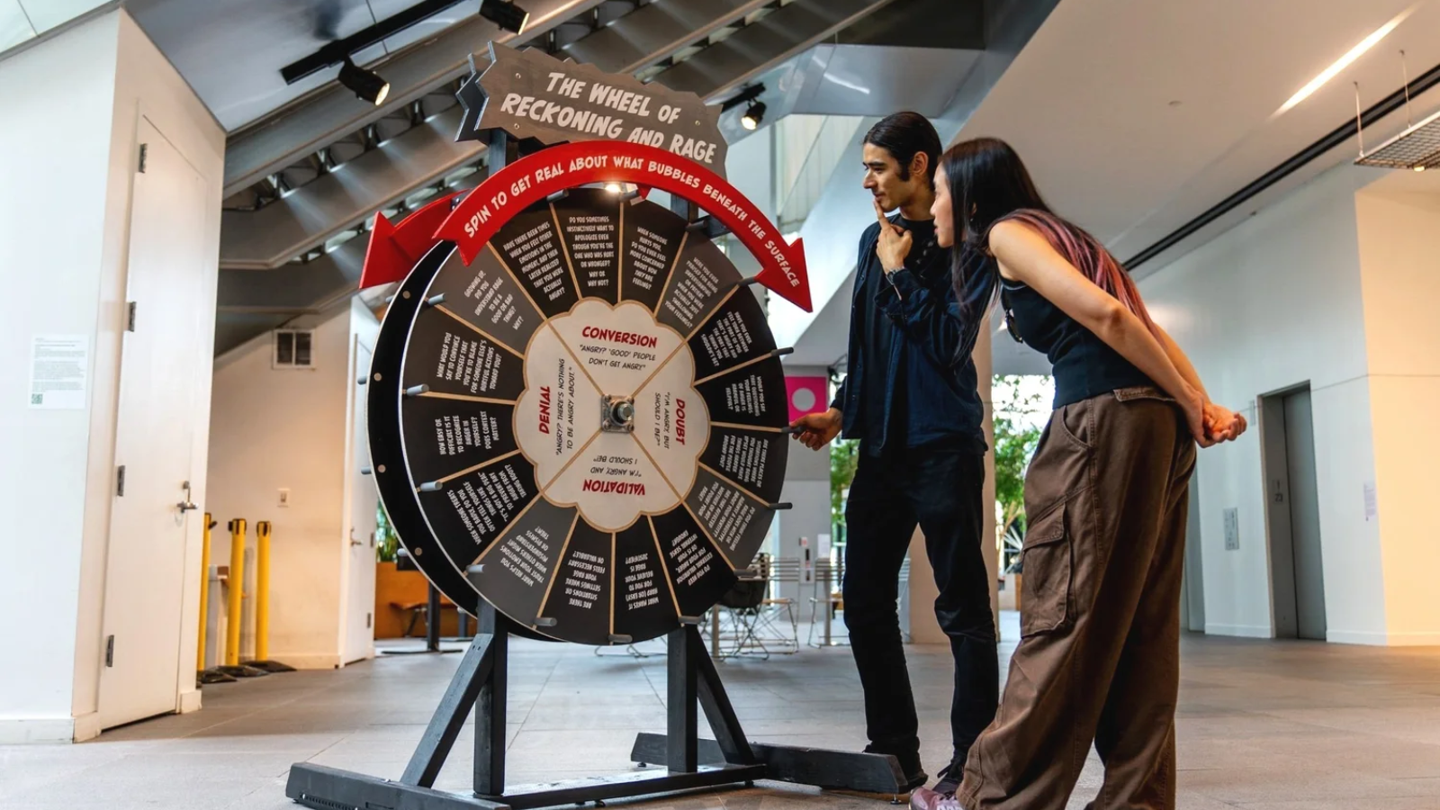 Participants looking at the Wheel of Reckoning and Rage