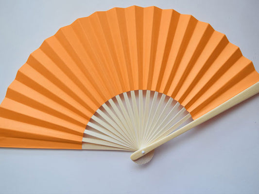 Vibrant orange paper folding fan
