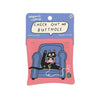 Catnip Toys: Black cat in a shirt, knitting, sitting on a blue couch with one leg up and it's butt showing as an x