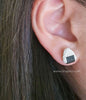 Woman wearing an onigiri earring