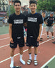 Two guys wearing the Chinatown swagger t-shirt at a park