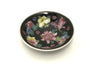 Flower pattern design on black sauce dish